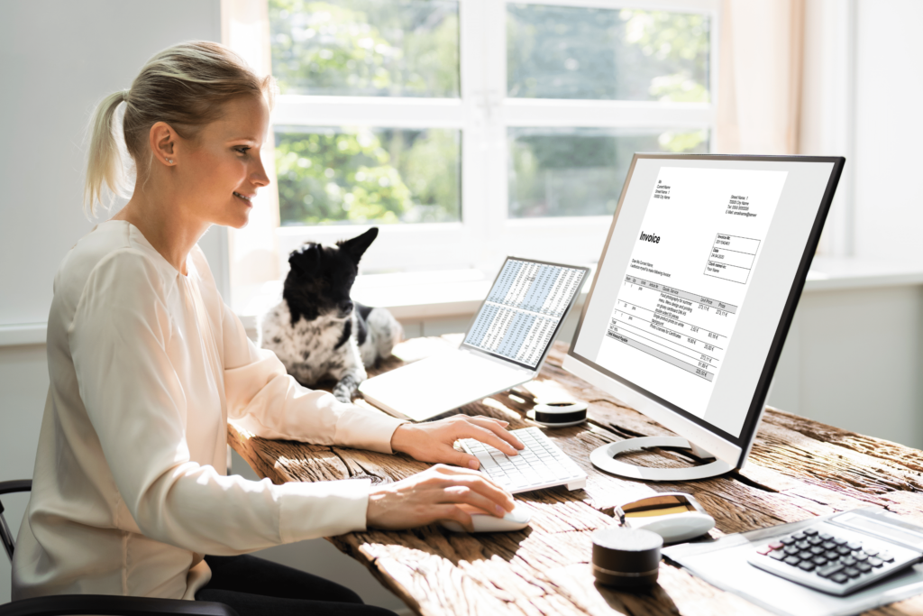 dog and a woman looking at laptop screen