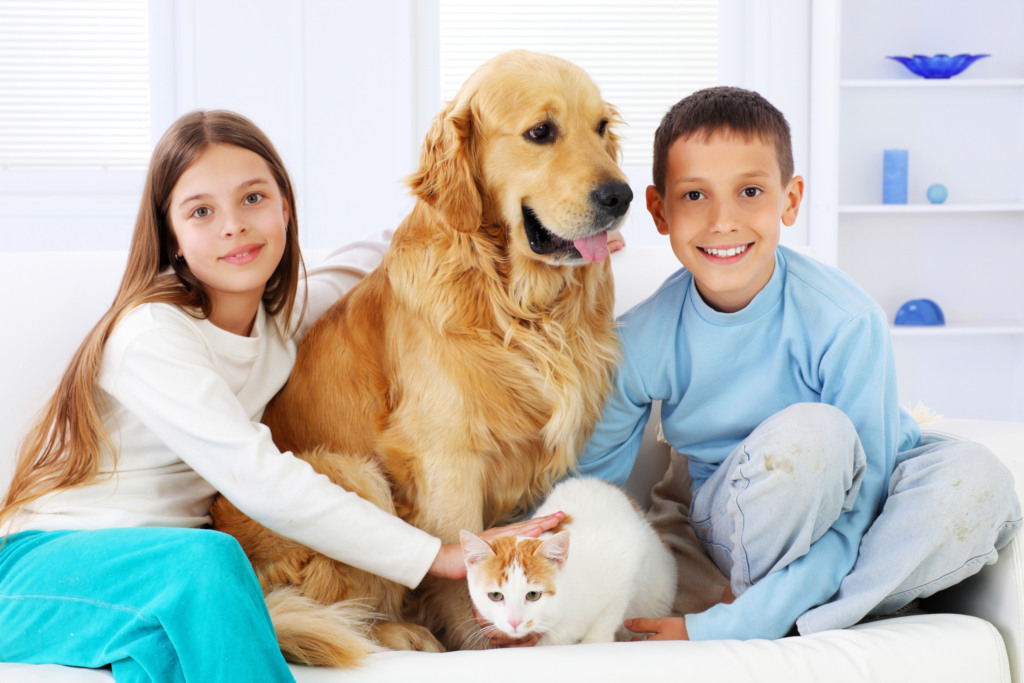 kids sitting with their pet